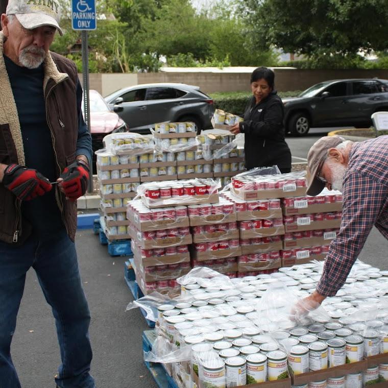 Food Programs Volunteers Volunteers sorting food donations for distribution