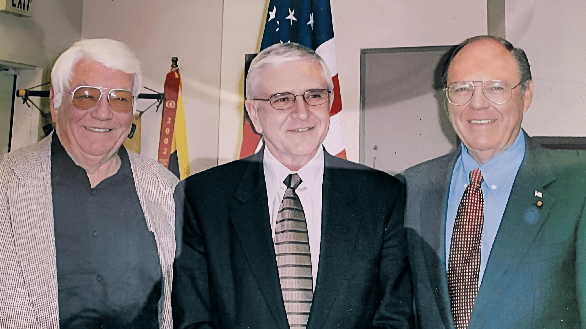 3 Generation of Riverside County Supervisors 3 gentleman in suits and US flag on the back
