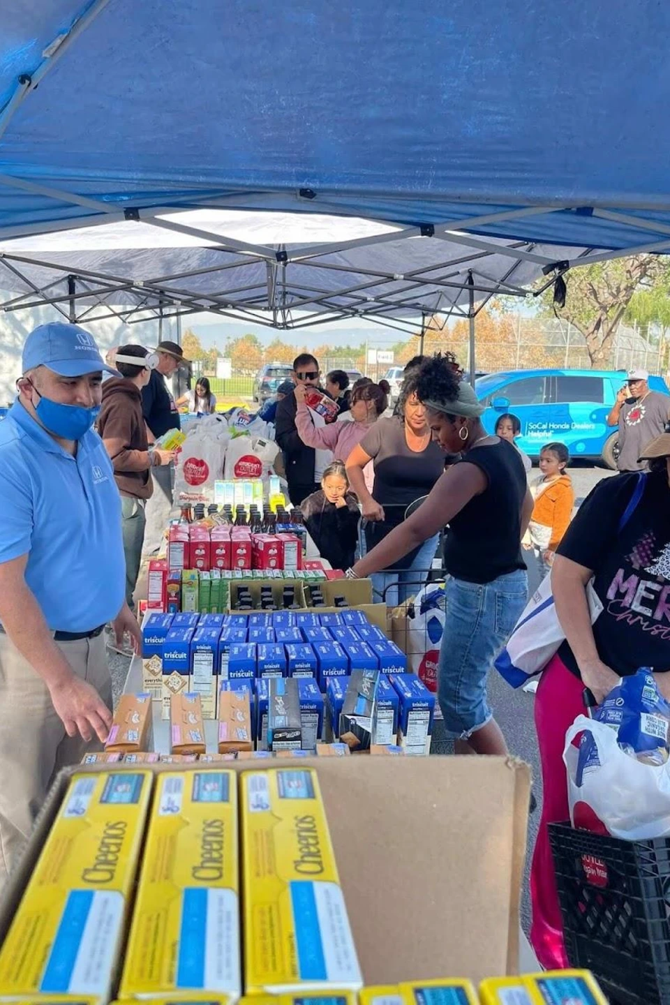 Volunteers and community members in a pantry  distribution event
