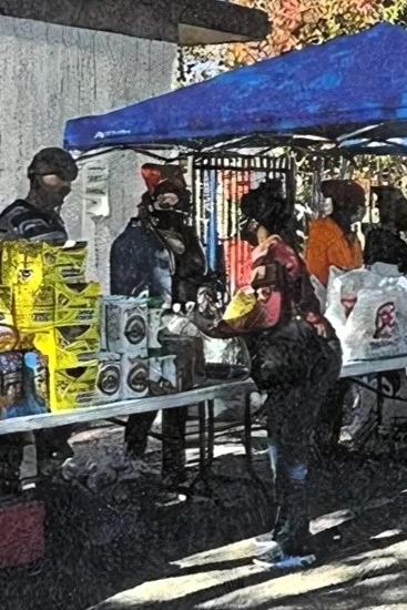 Community memebers in a food distribution site